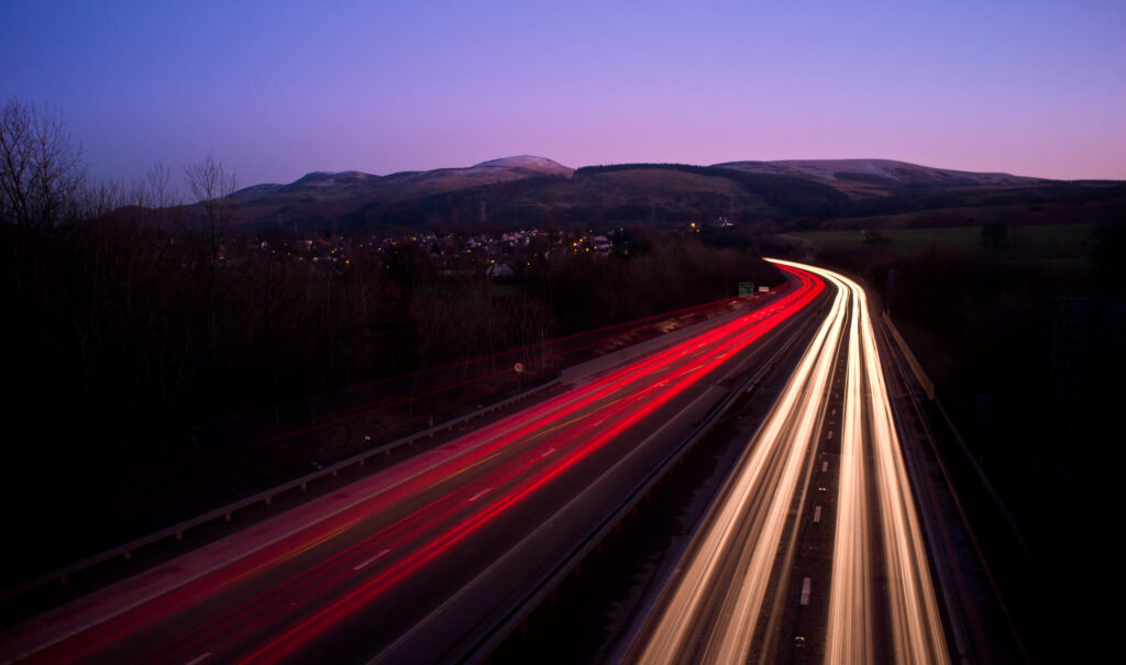 Stunning Night Highway Wallpaper: Edinburgh Hills & Light Streaks