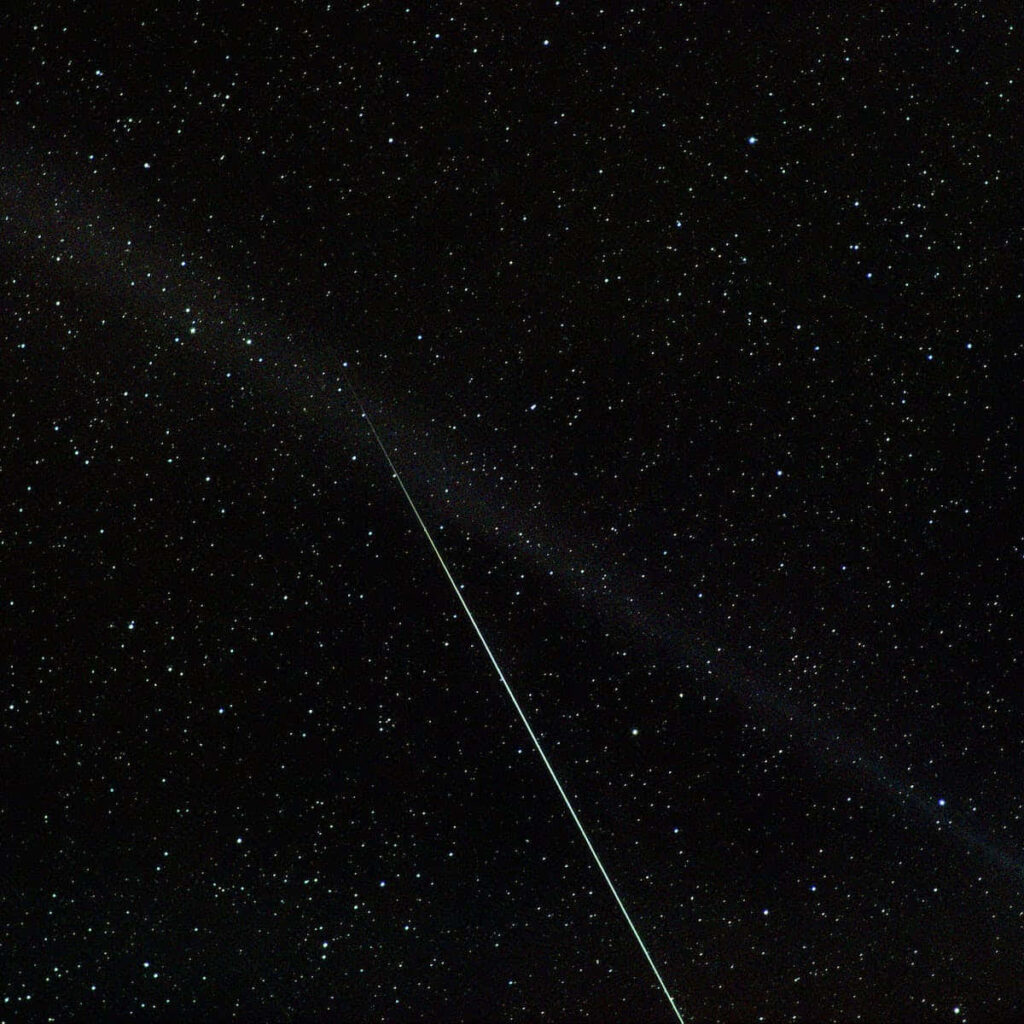 Stunning Starry Night Wallpaper: Meteor in a Dark Sky