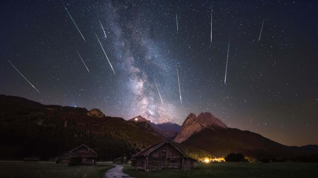 Stunning Milky Way & Meteor Shower over Countryside Wallpaper