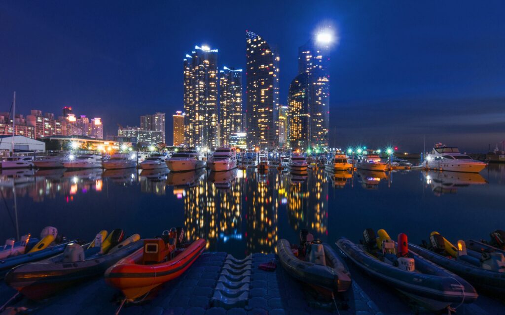 Serene Night City Skyline Wallpaper with Luminous Reflections