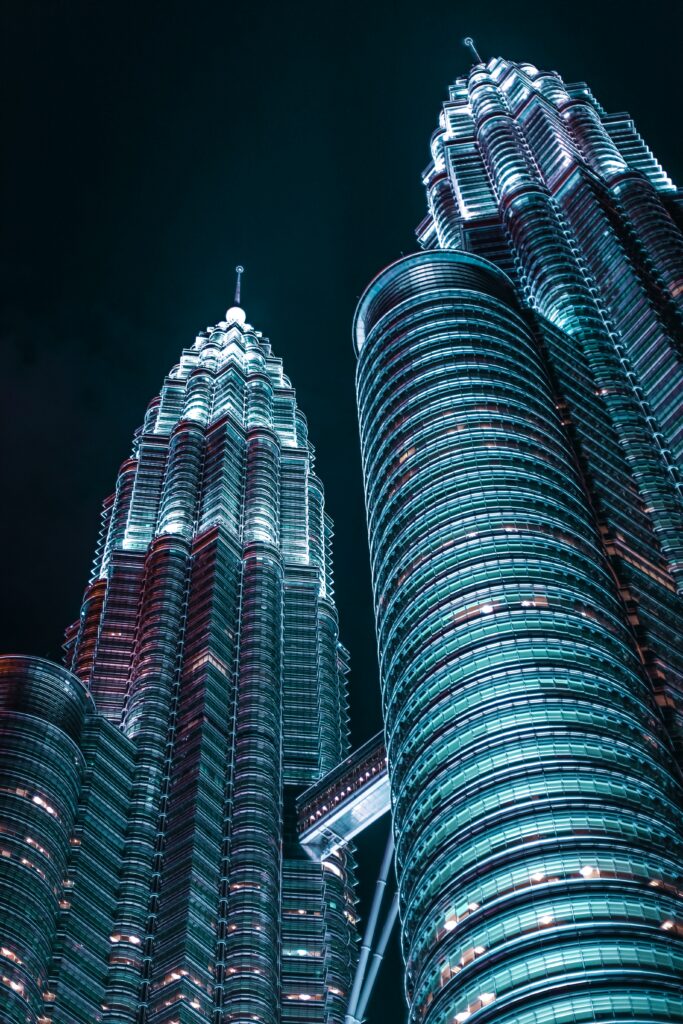 Stunning Nighttime Skyscraper Wallpaper: Dramatic Low-Angle View