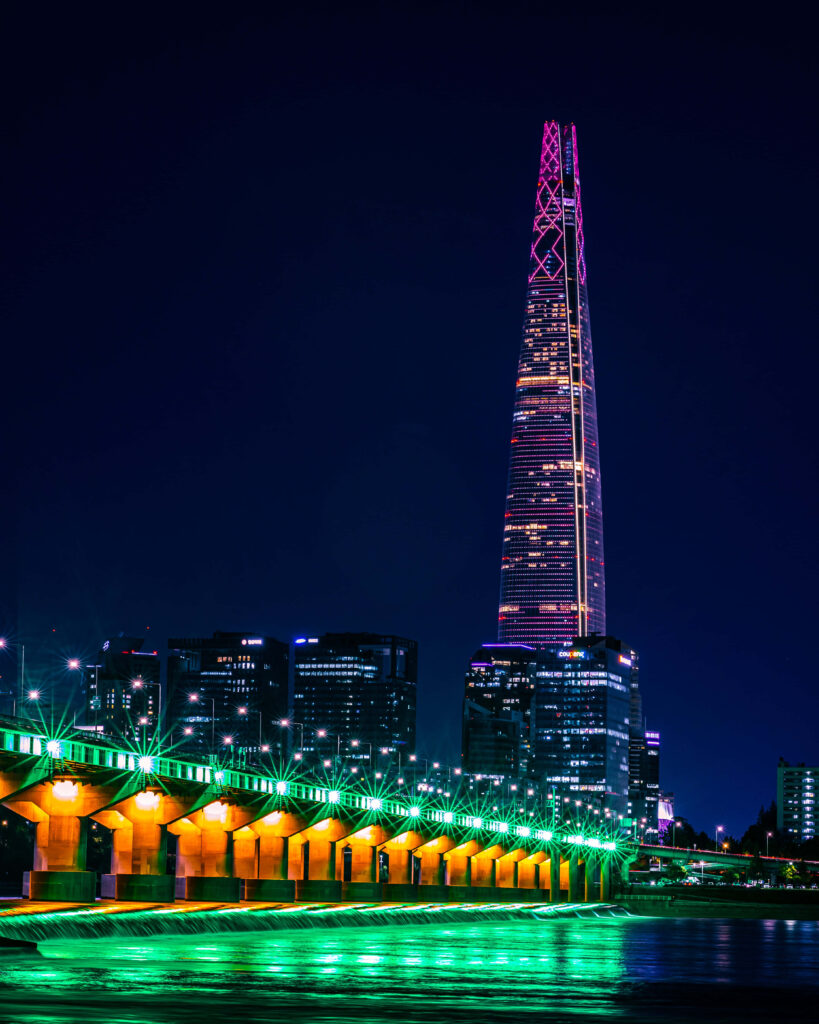 Stunning Night Skyscraper & Bridge Reflection - Vibrant Wallpaper