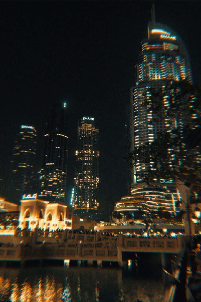 Stunning Nightscape Wallpaper: Illuminated Skyscrapers Reflected