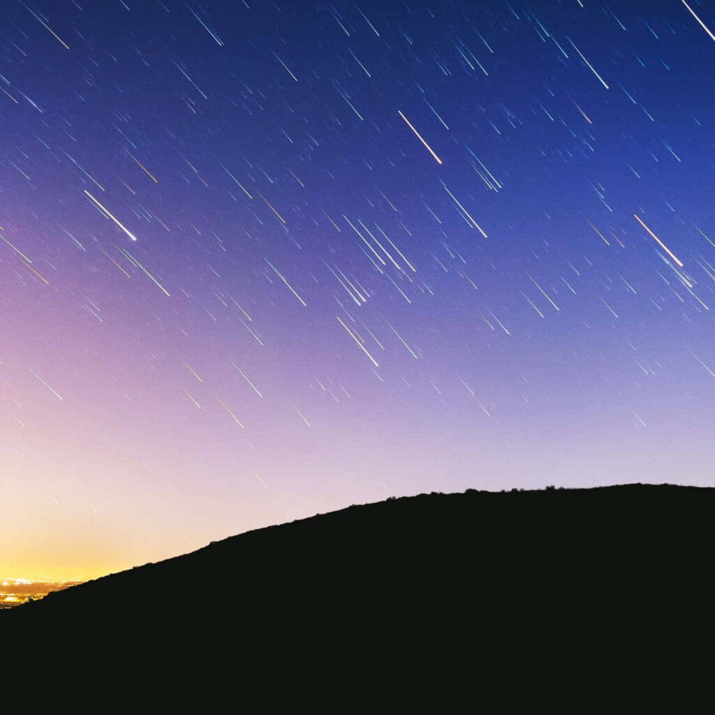 Stunning Nightscape with Meteor & Star Trails – Serene Hill Wallpaper