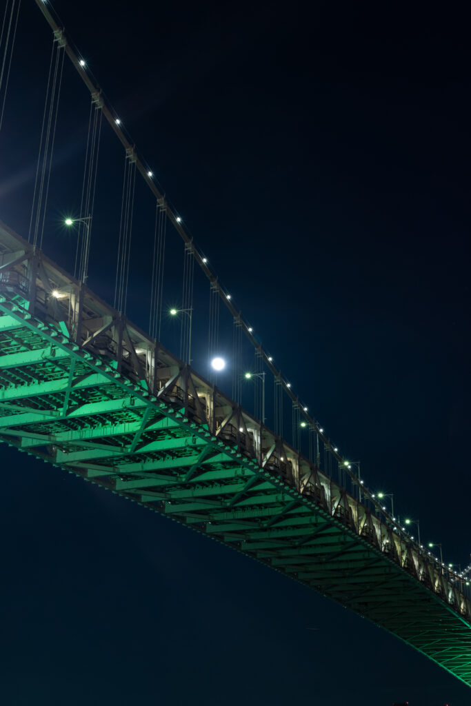 Stunning Night Wallpaper: Illuminated Metal Bridge with Green Glow