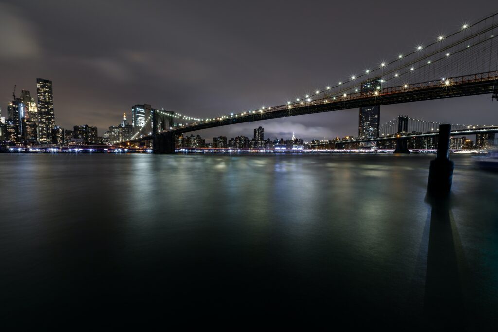 Stunning Nighttime Bridge Wallpaper with City Skyline Reflections