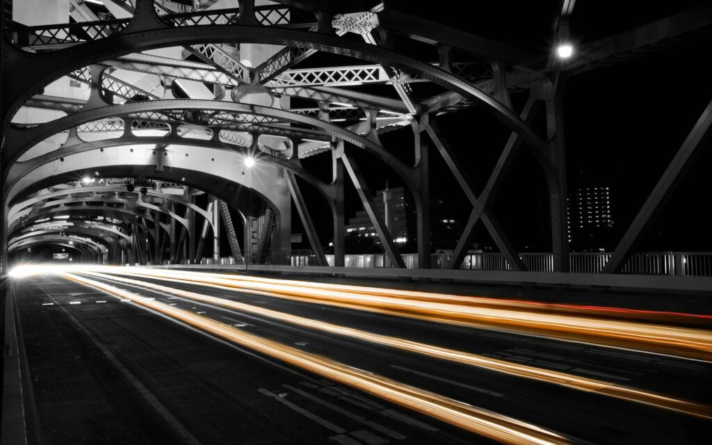 Stunning Nighttime Bridge Wallpaper: Urban Lights & Traffic Trails
