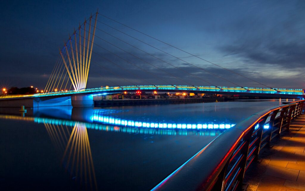 Stunning Nighttime Bridge Wallpaper with Urban Reflections
