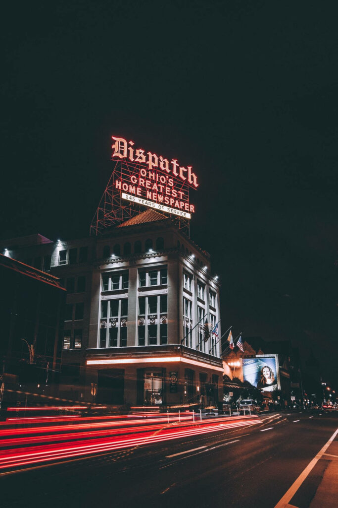 Nighttime Cityscape Wallpaper: Illuminated Dispatch Ohio Sign & Car Lights