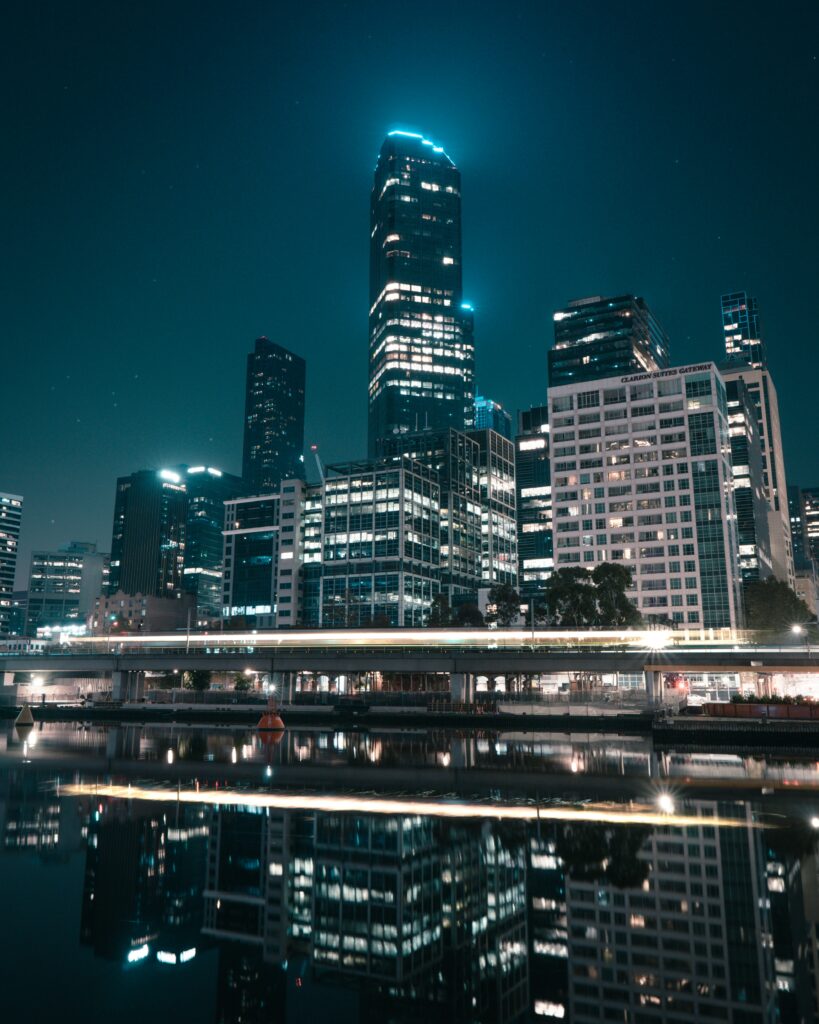 Stunning Nighttime Cityscape Wallpaper: Illuminated Skyline Reflection
