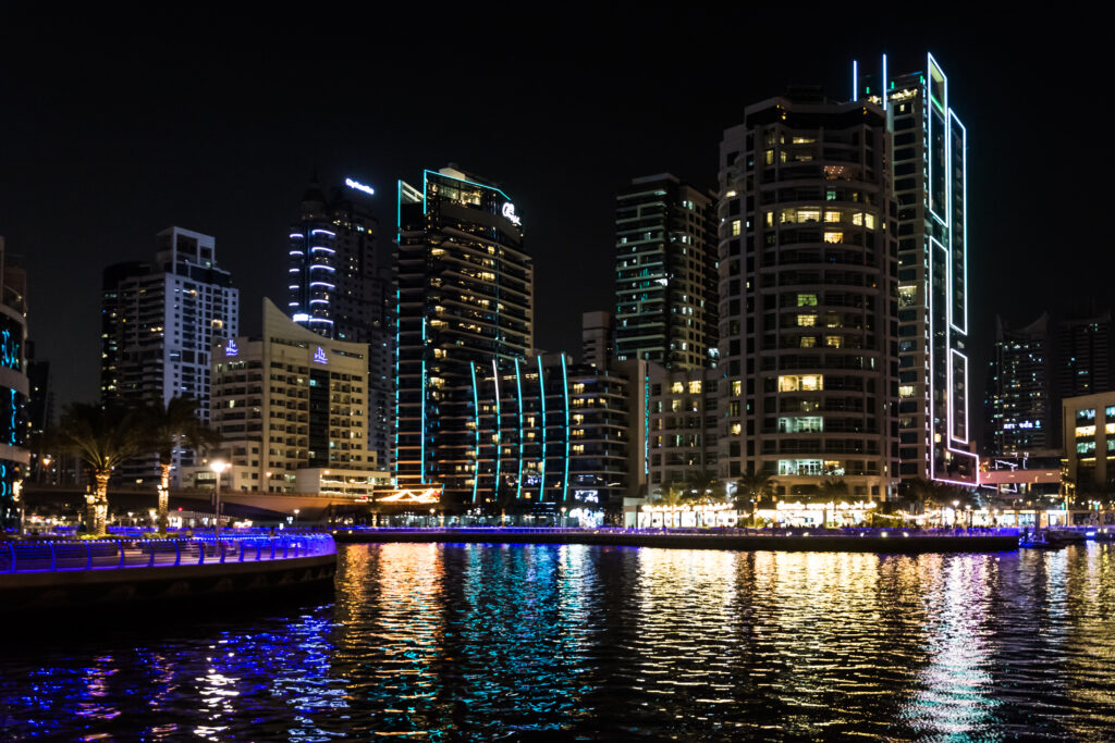 Stunning Nighttime Cityscape Wallpaper with Illuminated Reflections
