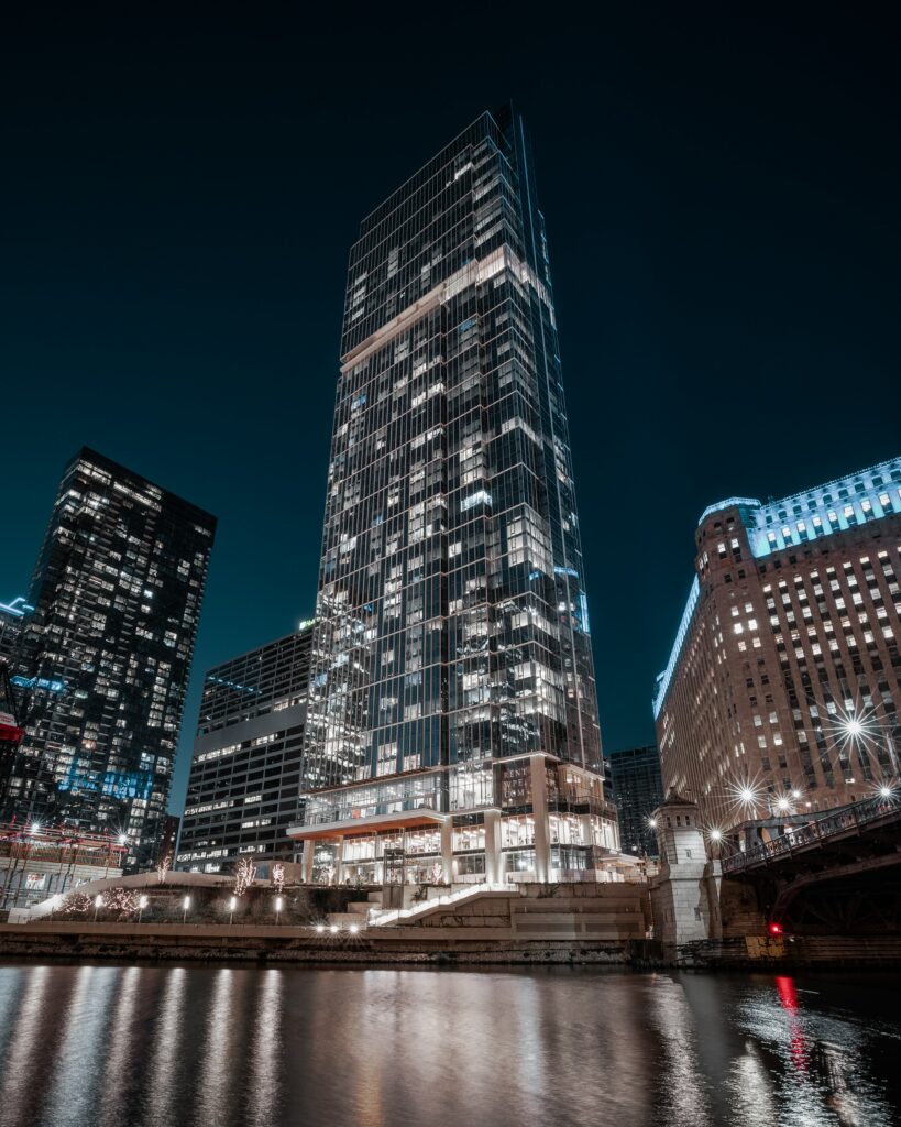 Stunning Nighttime Cityscape Wallpaper: Modern Skyscraper Reflections