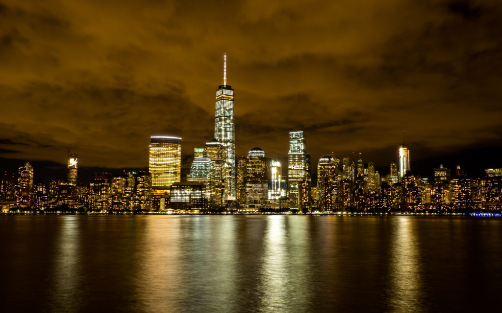 Stunning Nighttime Cityscape Wallpaper: Vibrant Urban Reflection