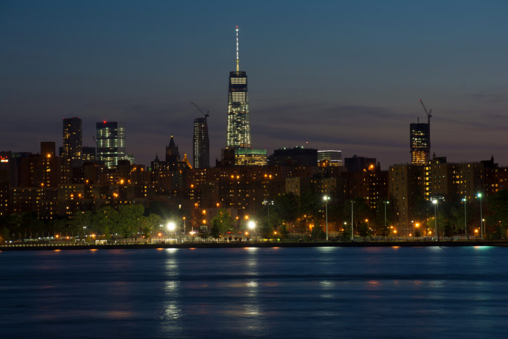 Stunning Nighttime Cityscape Wallpaper: Illuminated Urban Reflections
