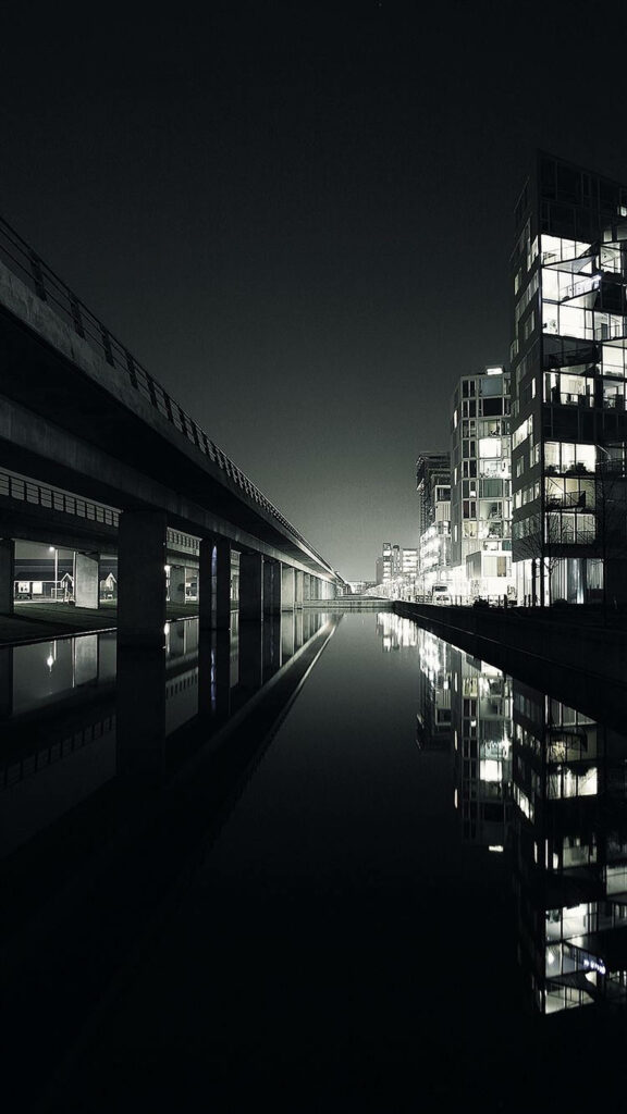 Nighttime Cityscape Wallpaper: Modern Bridge & Reflections in Water
