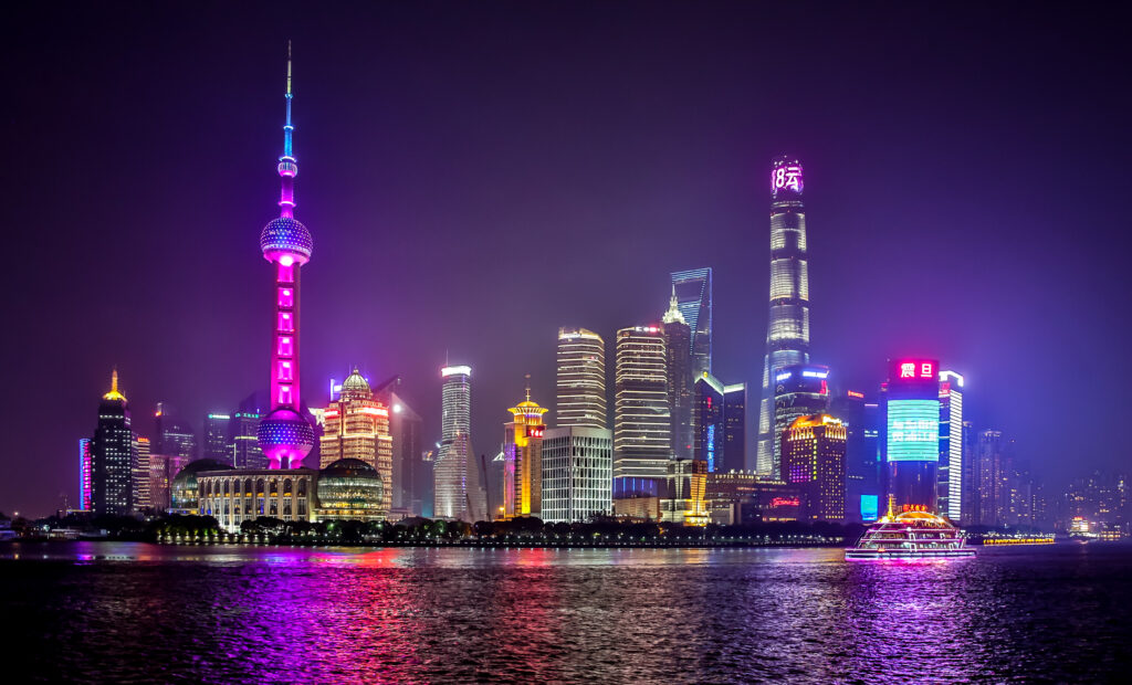 Stunning Nighttime Cityscape Wallpaper: Neon Towers & Reflections