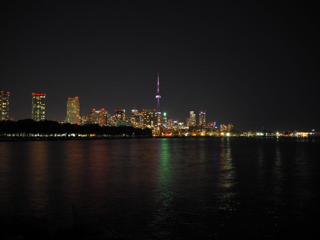 Stunning Nighttime Cityscape Wallpaper with Reflections and Lights
