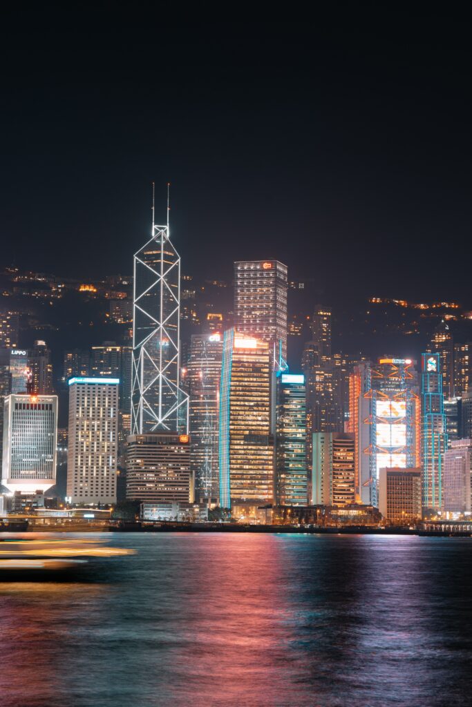 Stunning Nighttime Cityscape Wallpaper: Vibrant Urban Reflection