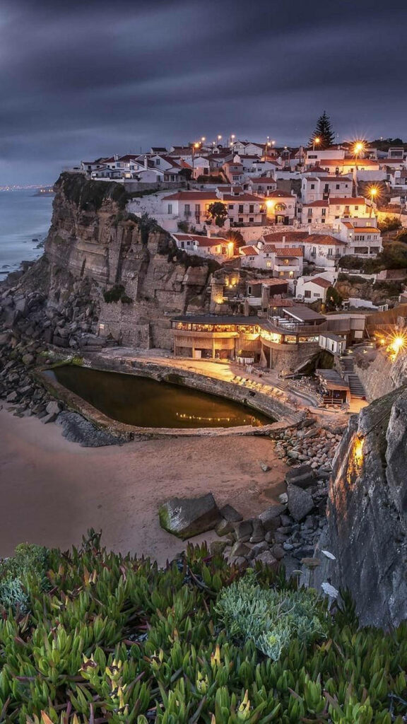 Serene Coastal Village Wallpaper: Nighttime Cliffs & Seaside Charm