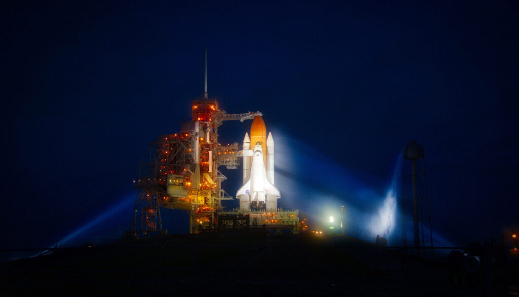 Stunning Kennedy Space Center Night View with Illuminated Shuttle Wallpaper