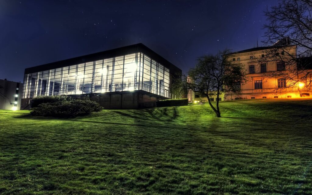 Serene Nighttime Landscape Wallpaper: Modern Glass & Classic Architecture