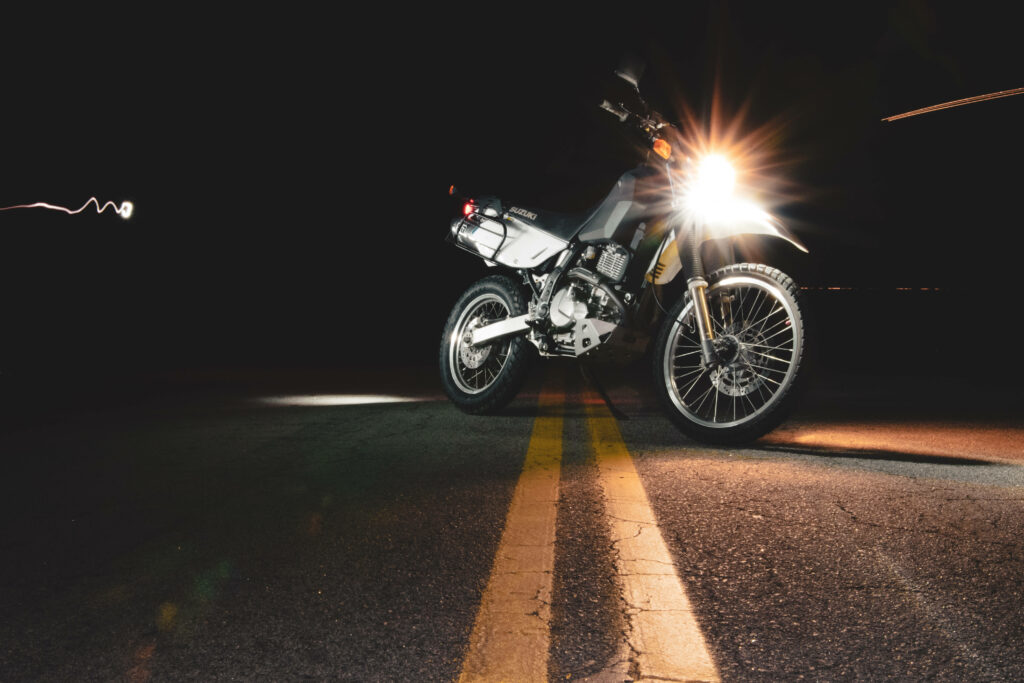 Nighttime Motorcycle Wallpaper: Sleek Design & Glowing Headlights