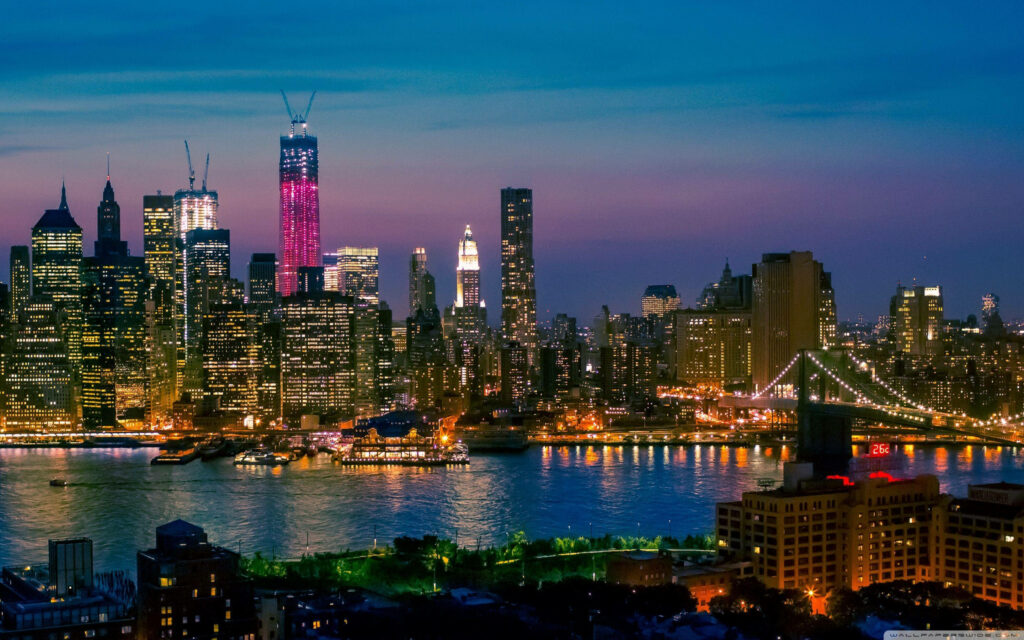 Stunning NYC Night Skyline Wallpaper: Illuminated Bridges & Calm Waters