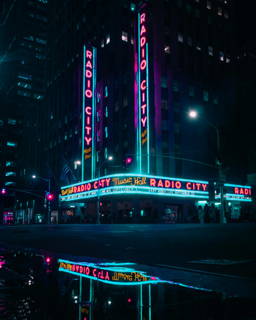 Vibrant Radio City Music Hall Neon Sign at Night - Wallpaper Background
