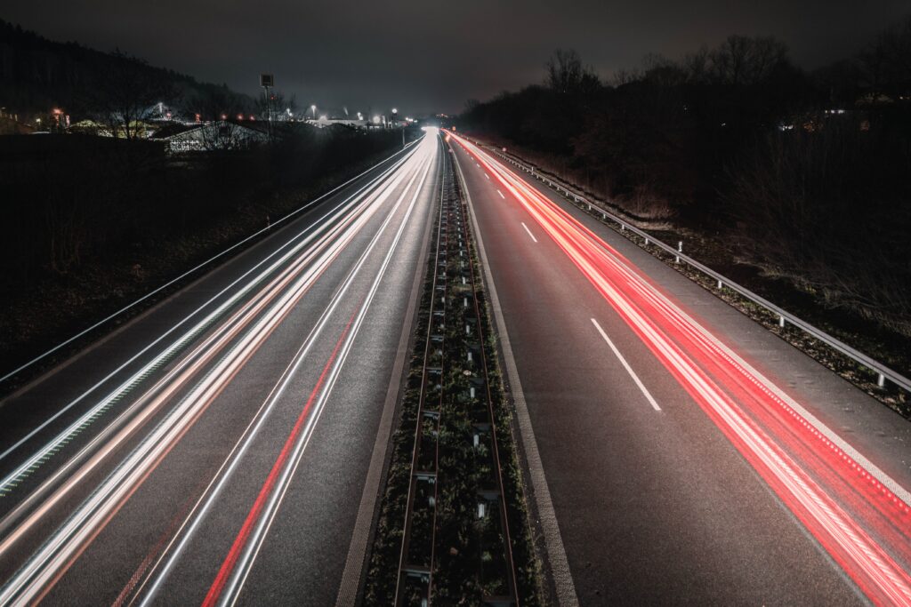 Stunning Night Road Wallpaper: Long-Exposure Light Trails Background