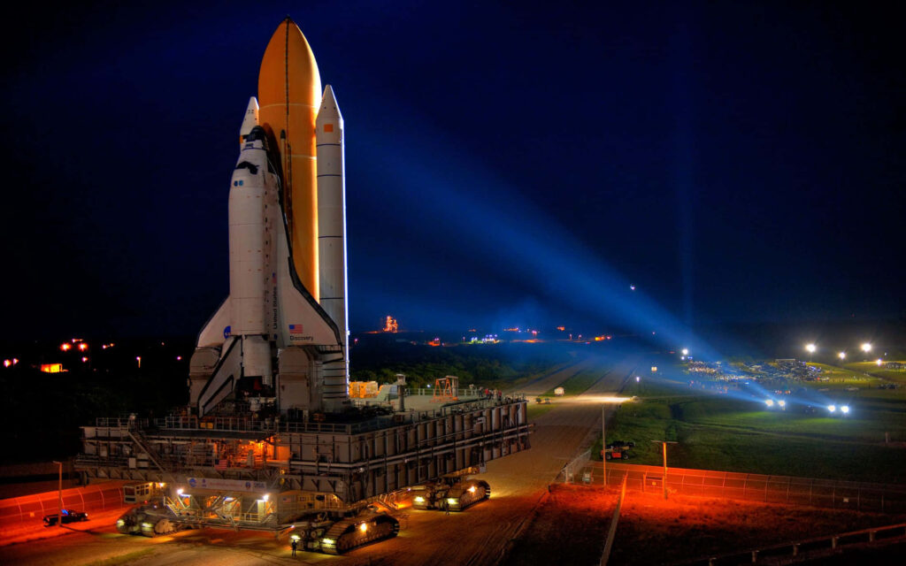 Stunning Nighttime Space Shuttle Wallpaper with Vibrant Lights