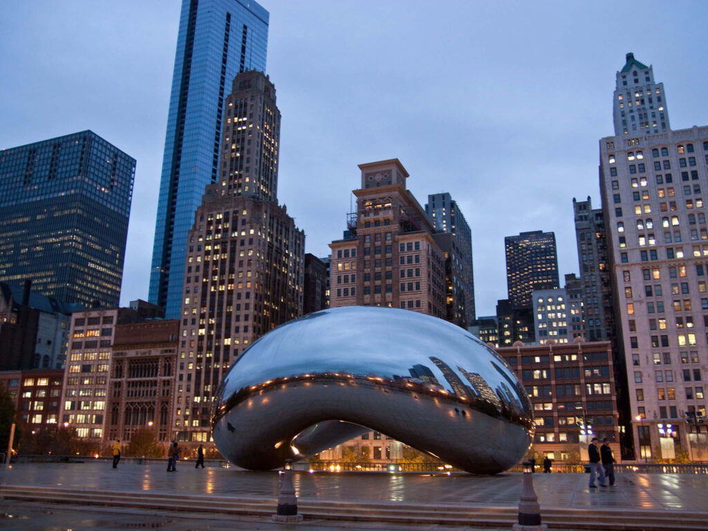 Stunning Nighttime Cloud Gate View: Chicago City Lights Wallpaper