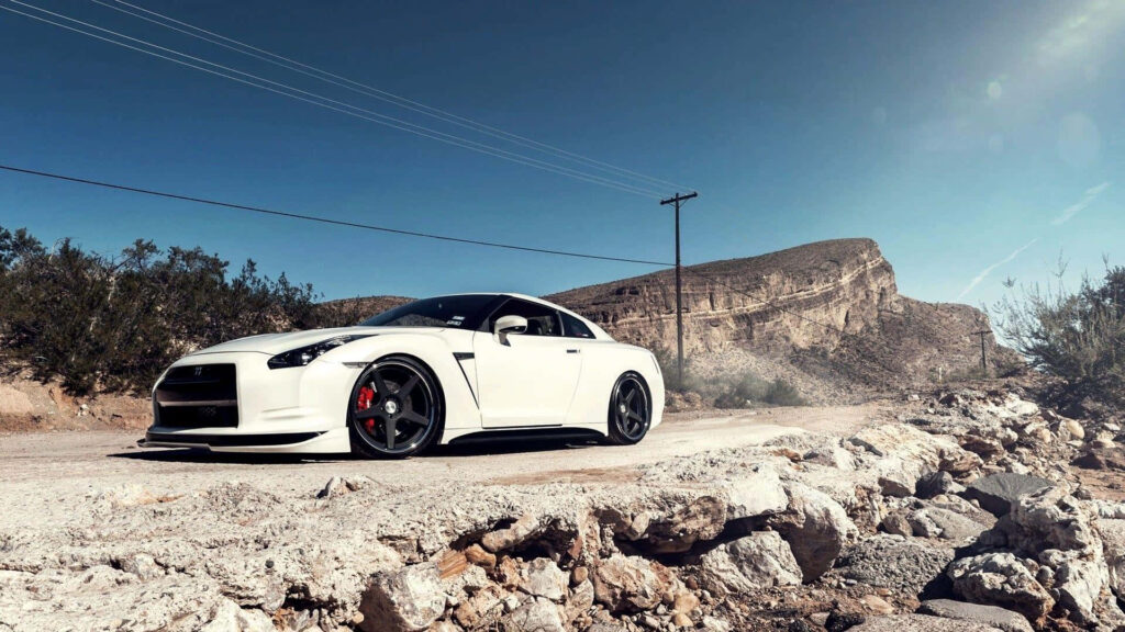 Stunning Nissan GT-R Wallpaper: Power & Luxury on Desert Road