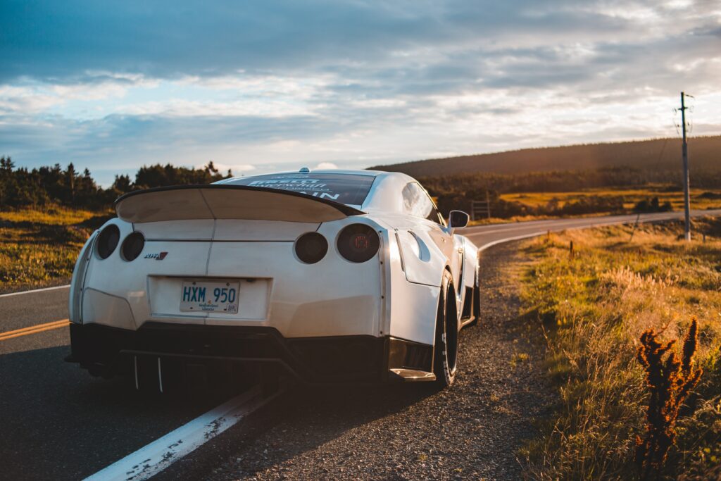 Stunning White Nissan GT-R Rear View on Winding Road Wallpaper