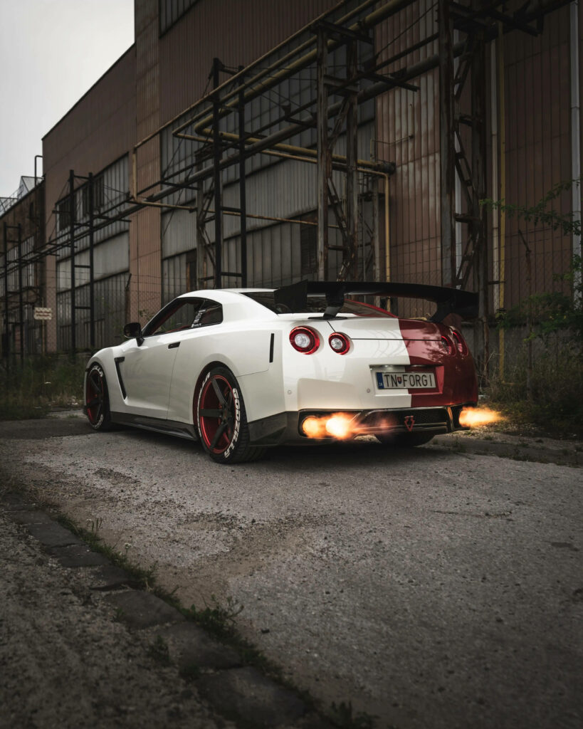 Stunning Nissan GT-R Wallpaper: Two-Tone, Flames, Industrial Vibe