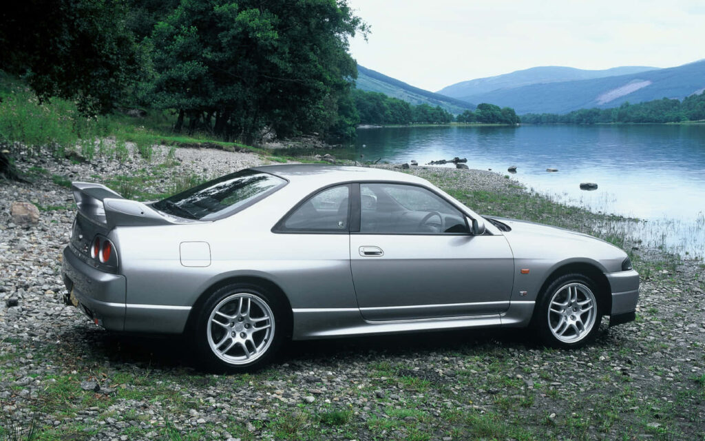 Nissan R33 GTR Wallpaper: Classic Car by Serene Lakeside