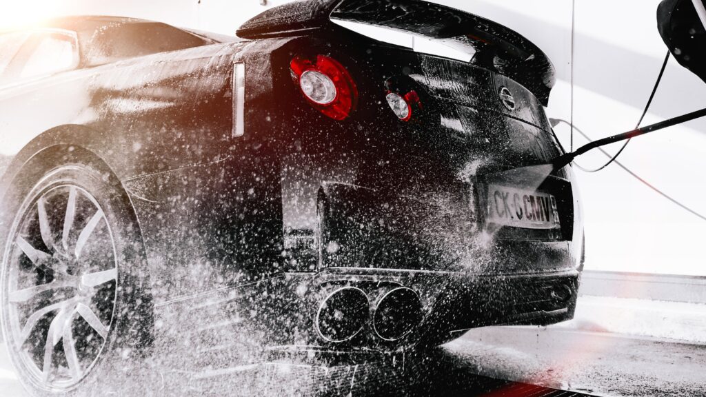 Nissan R35 GT-R: Dynamic Wash Highlighting Sleek Design and Power Wallpaper