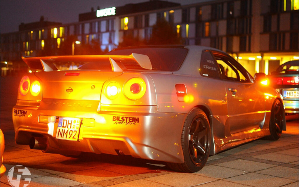 Stunning Nissan Skyline GT-R R34 Wallpaper Under City Lights