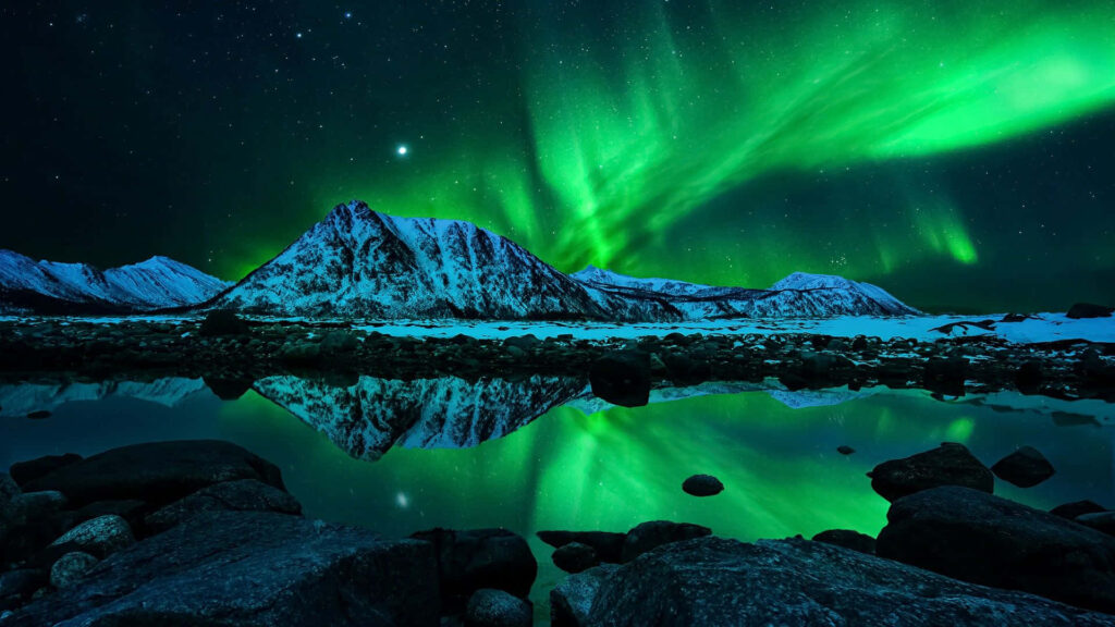Stunning Northern Lights Reflection Over Snowy Mountains - Wallpaper