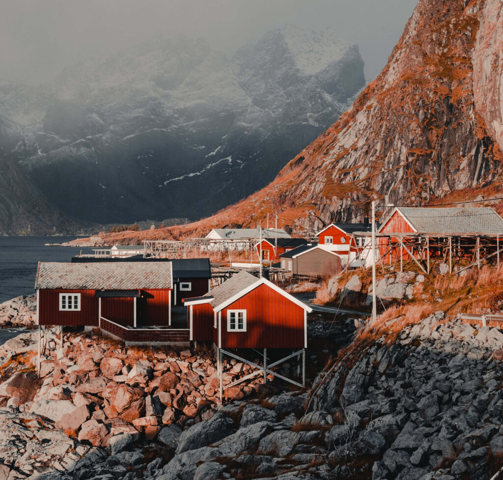 Stunning Norwegian Fjord Wallpaper: Red Cabins & Dramatic Cliffs