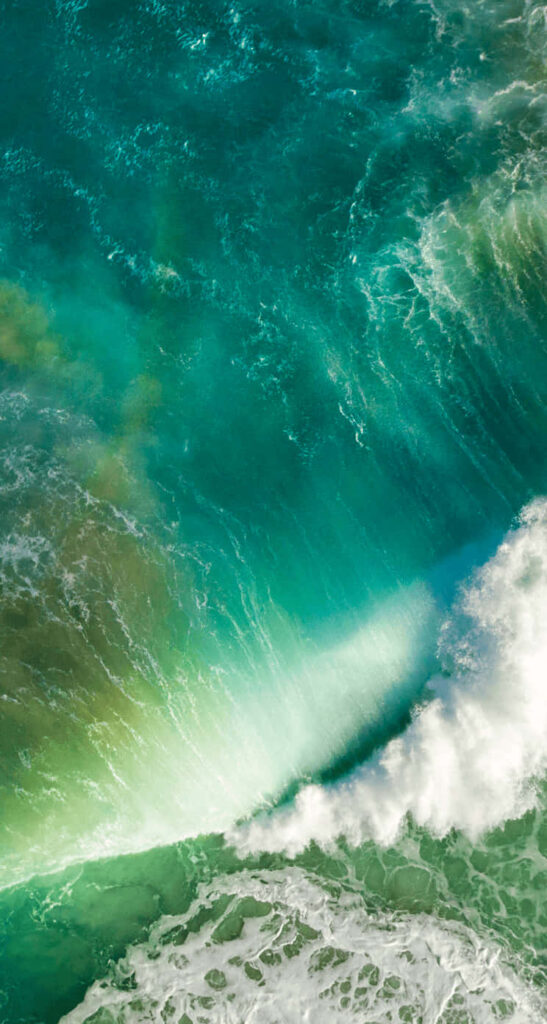 Stunning Aerial Ocean Wave Wallpaper in Vibrant Turquoise and Blue