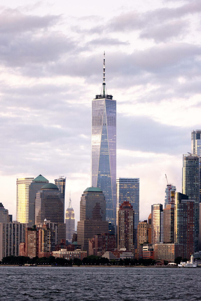 “Stunning One World Trade Center Wallpaper: NYC Skyline & Clouds”