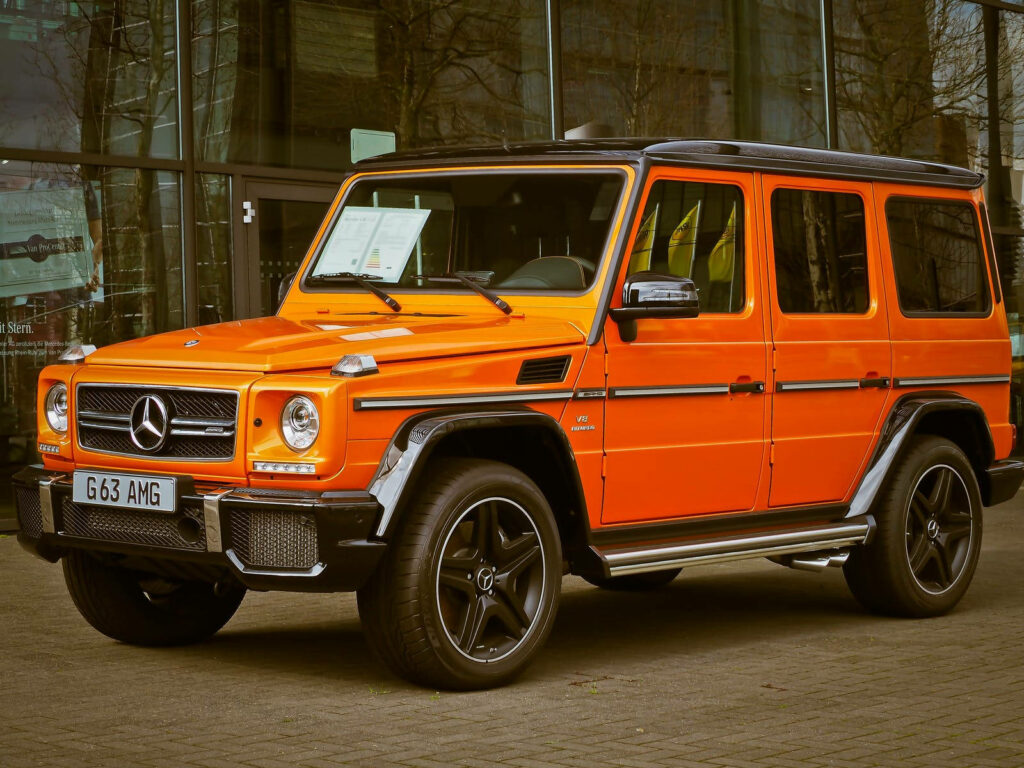 Stunning Orange Mercedes Benz G63 Wallpaper - Luxury & Rugged Charm