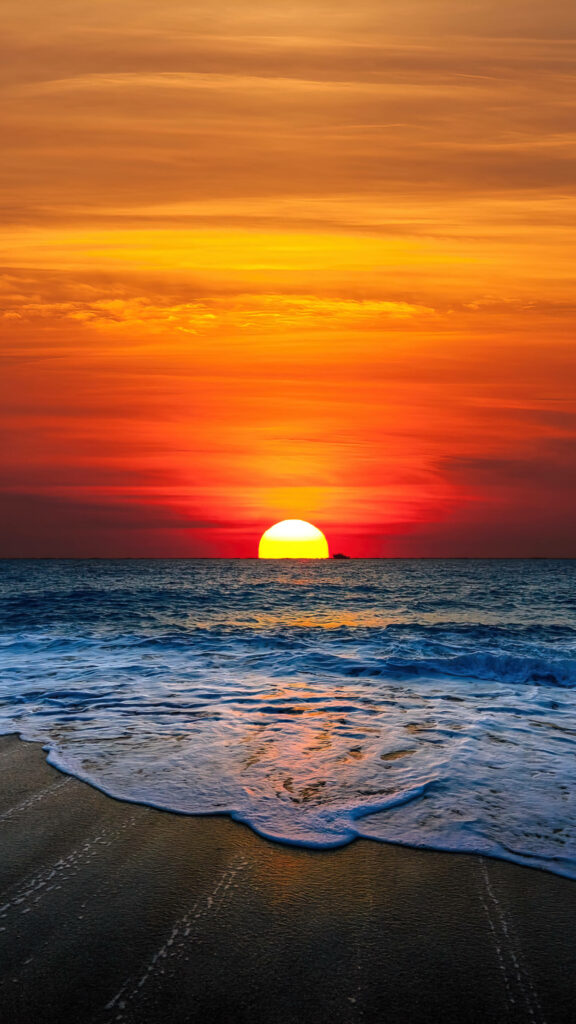 Stunning Orange Sunset Beach Wallpaper: Tranquil Background for Devices