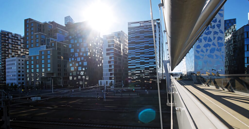 Stunning Oslo Modern Architecture Wallpaper: Sunlit Cityscape