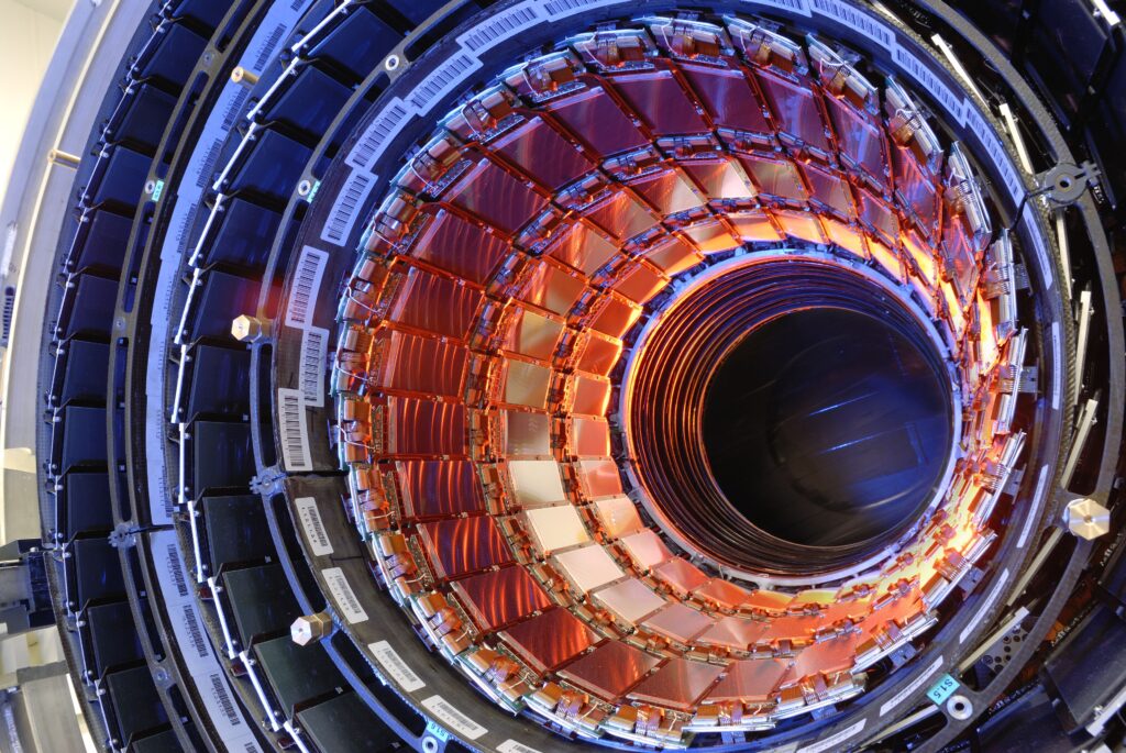 Mesmerizing Particle Accelerator Wallpaper: Vivid Tech Marvel Background
