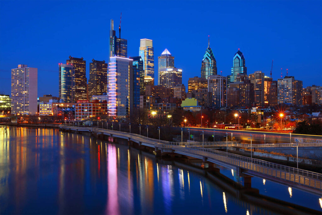 Philadelphia Skyline Night Wallpaper: Reflective Cityscape Background