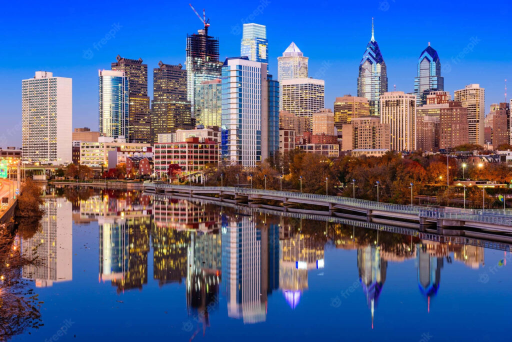 Philadelphia Skyline Daytime Wallpaper: City Reflection in Calm Waters