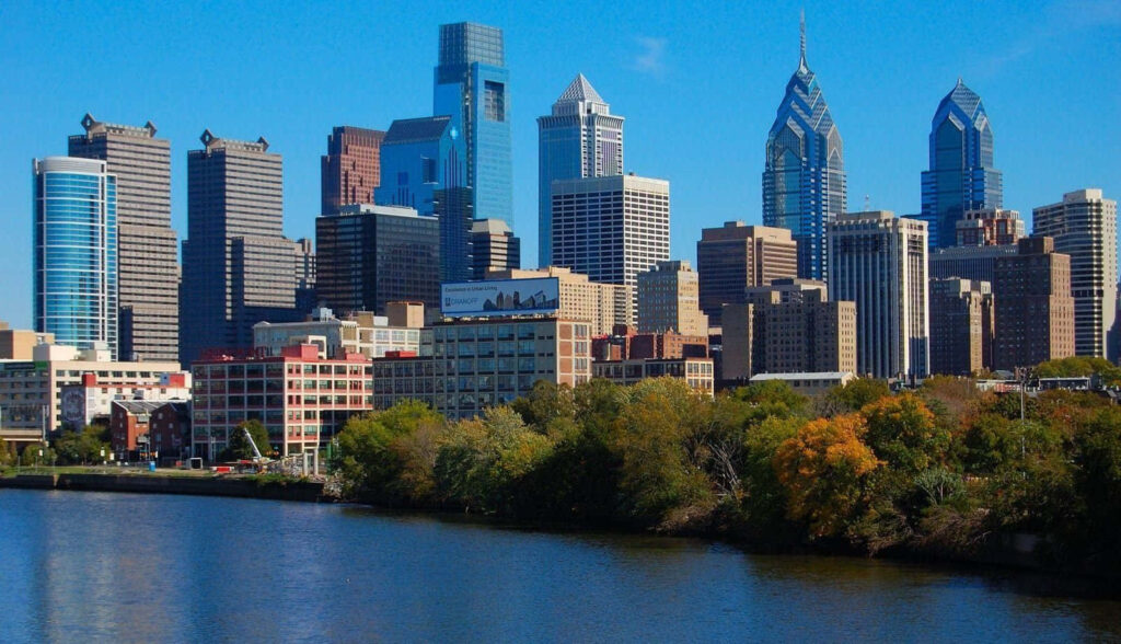 Stunning Philadelphia Skyline Wallpaper with Blue Sky & Vibrant Greenery