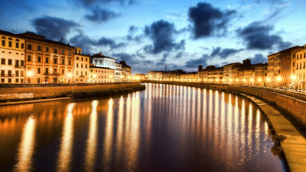 Stunning Pisa Riverfront Wallpaper: Evening Sky & Historical Charm