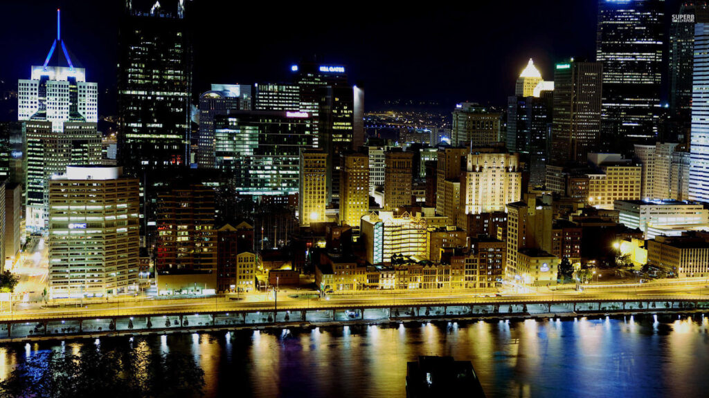 Stunning Pittsburgh Skyline Night View: Illuminated Skyscrapers Wallpaper